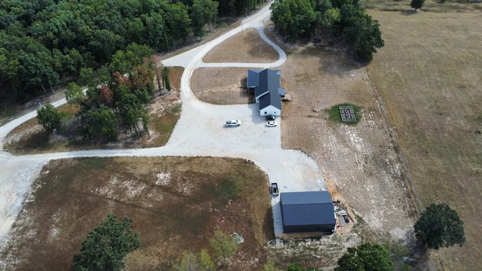Aerial view of a home site and new driveway