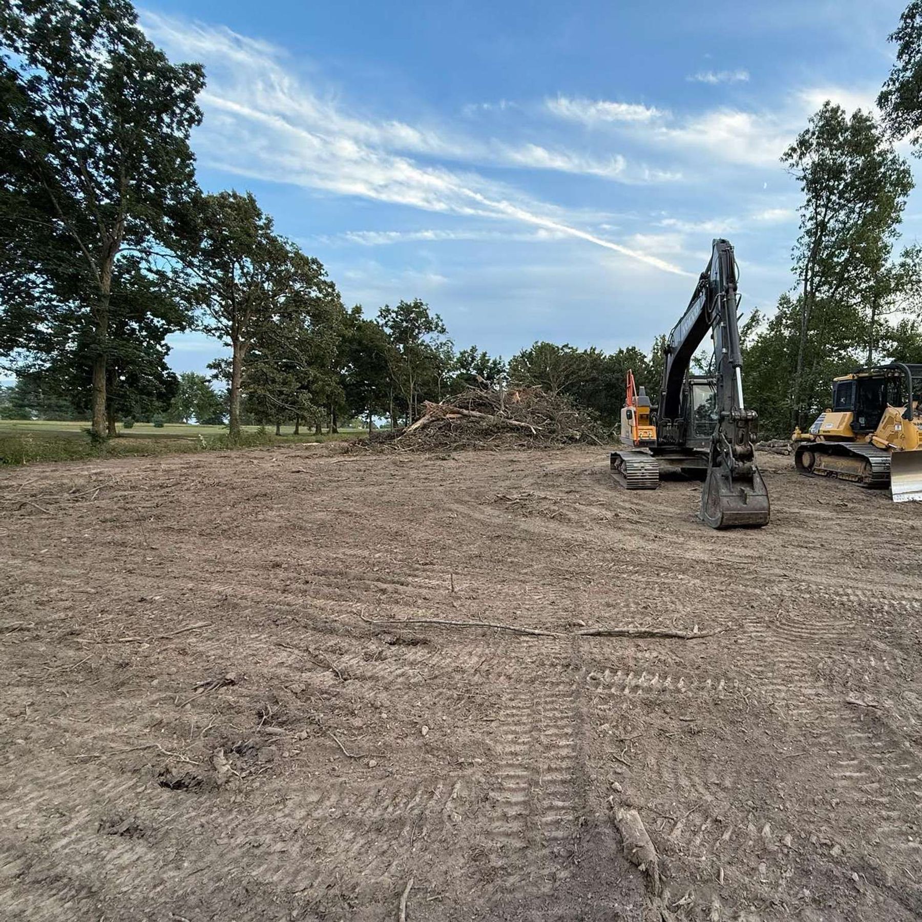 SiteForge excavator and dozer on a project